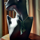 Hand made New Zealand Kawakawa jade toki with koru pendant. Hand carved in New Zealand by Rueben Tipene. Hand made jewellery. Unique large Jade Toki with adjustable cord. Free shipping worldwide.